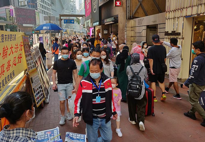 Shoppers in Hong Kong wearing masks during the COVID-19 pandemic, March 2020. (Andrii Makukha/Wikimedia)