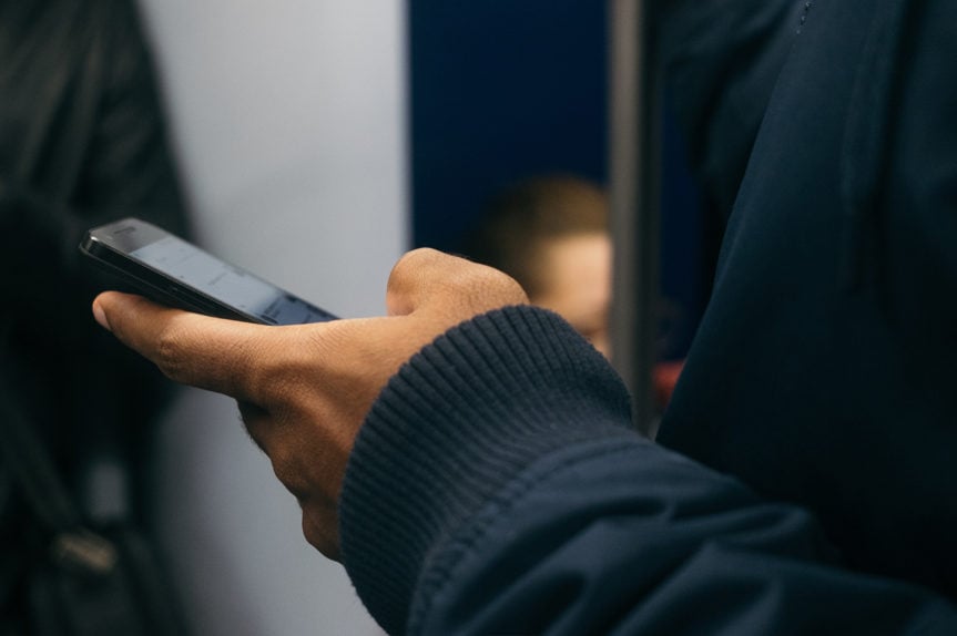 Man typing on phone
