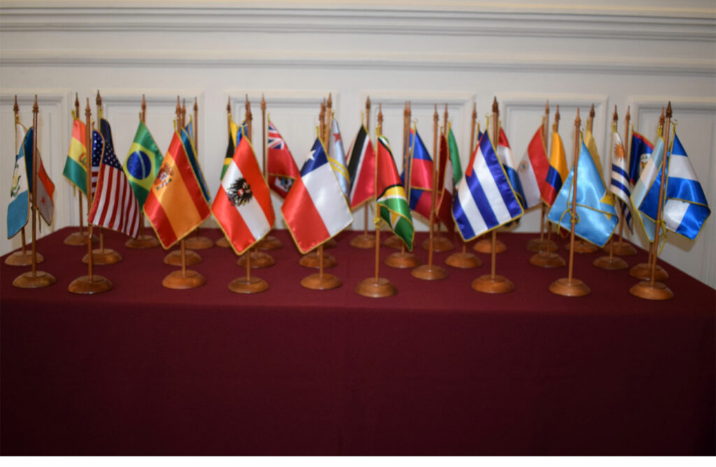 Small flags of various countries on a desk