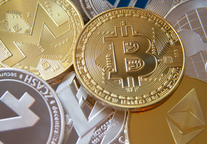 Pile of cryptocurrency coins including Bitcoin, Monero, ZCash, Ethereum, Litecoin, Ripple, and Dash. (Photo: QuoteInspector/Flickr)