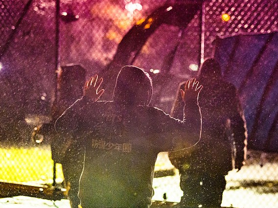 Police mace demonstrators outside the Minneapolis Police Department's 4th Precinct building in North Minneapolis on November 18, 2015. (Tony Webster/Wikimedia)