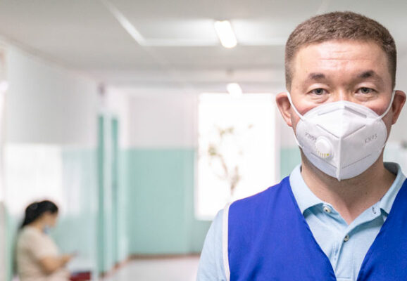 volunteer worker with mask in hospital hallway