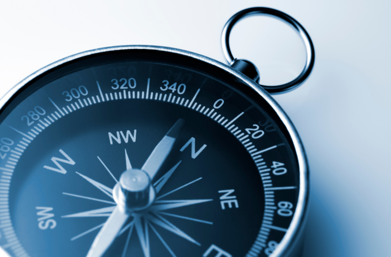 Image of compass on blue background