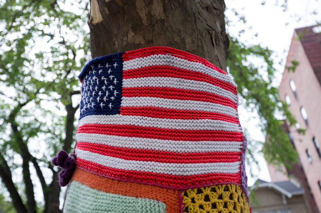 Keeping guns away from protests; American flag crocheted around a tree in a Brooklyn Park. (Photo: Andriy Prokopenko/Getty)