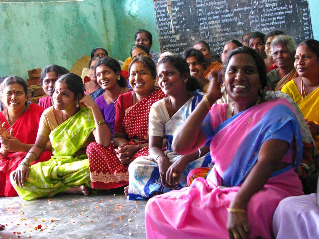 OECD DAC Recommendation; ICNL 2009-2010 Annual Report cover photo - A women's savings group meeting