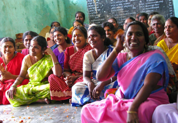 ICNL 2009-2010 Annual Report cover photo - A women's savings group meeting