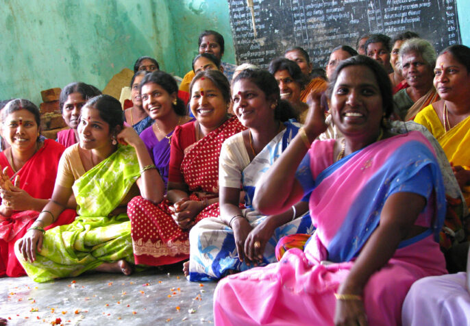 ICNL 2009-2010 Annual Report cover photo - A women's savings group meeting