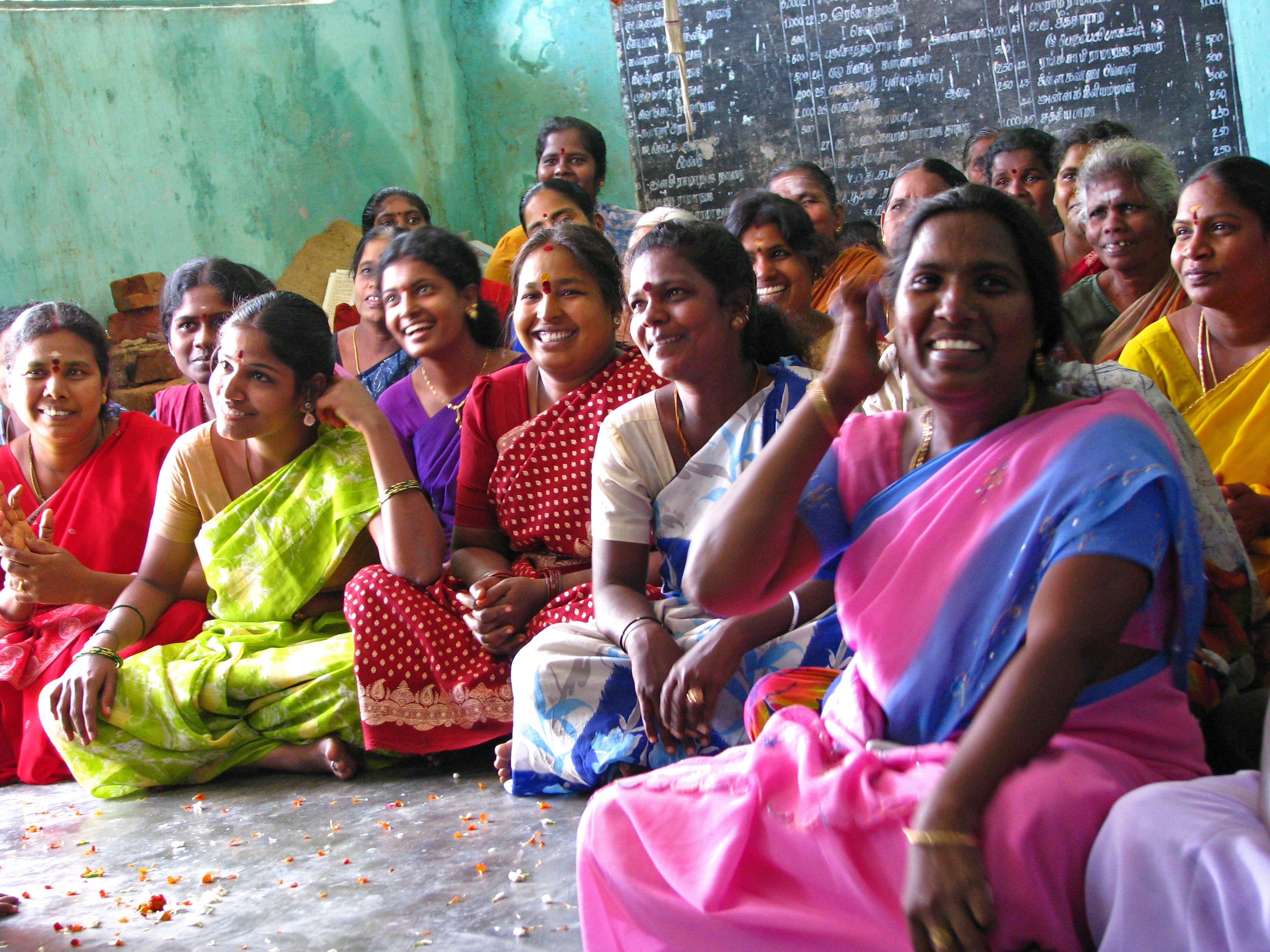 ICNL 2009-2010 Annual Report cover photo - A women's savings group meeting