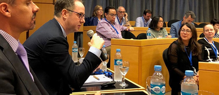 At a high-level event on the margins of the November 2018 G20 Summit, the executive secretary of the Financial Action Task Force, David Lewis, explains that governments must collaborate with civil society organizations to mitigate barriers to financial services. (Photo credit: ICNL)