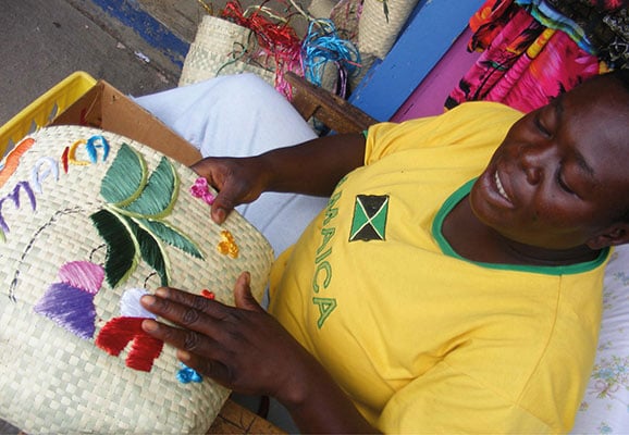 A woman displaying crafts in Jamaica (Photo Credit: Mary Sauers)