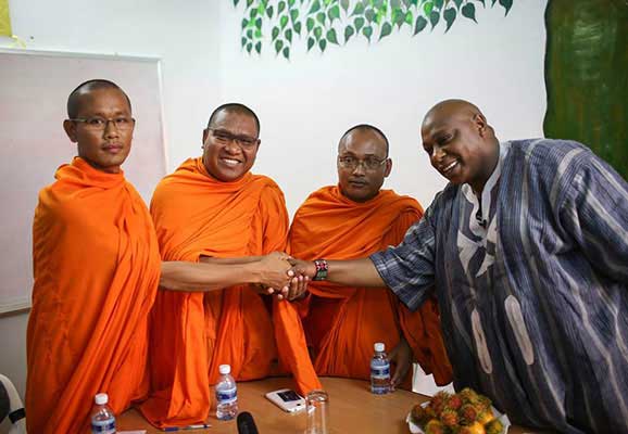 UN Special Rapporteur Maina Kiai meets with Buddhist monks in Cambodia during his visit to the country in February 2014 (photo credit: Jeff Vize)