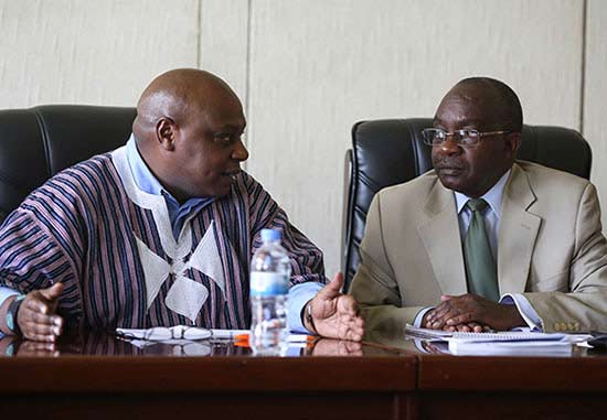 The United Nations special rapporteur on the rights to freedom of peaceful assembly and of association Maina Kiai speaks to a government official during an official visit to Rwanda in January 2014. (Photo credit: Jeff Vize)