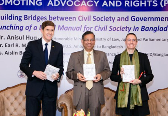 US Ambassador to Bangladesh Mr. Earl Miller, Mr. Anisul Huq, Minister, Law, Justice and Parliamentary Affairs, and DFID Senior Governance Adviser Ms. Aislin Baker were special guests at the Building Bridges between Civil Society and Government launch event in Dhaka, Bangladesh. (Photo: CPI)