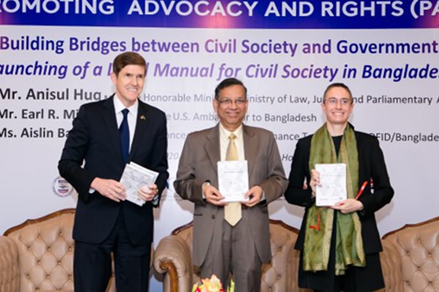 US Ambassador to Bangladesh Mr. Earl Miller, Mr. Anisul Huq, Minister, Law, Justice and Parliamentary Affairs, and DFID Senior Governance Adviser Ms. Aislin Baker were special guests at the Building Bridges between Civil Society and Government launch event in Dhaka, Bangladesh. (Photo: CPI)