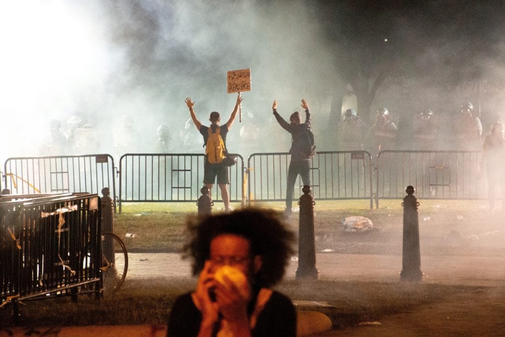 Reforming anti-riot laws; Black Lives Matter protesters enveloped in tear gas, near the White House in Washington DC, 5/31/2020 (Photo by Koshu Kunii on Unsplash)