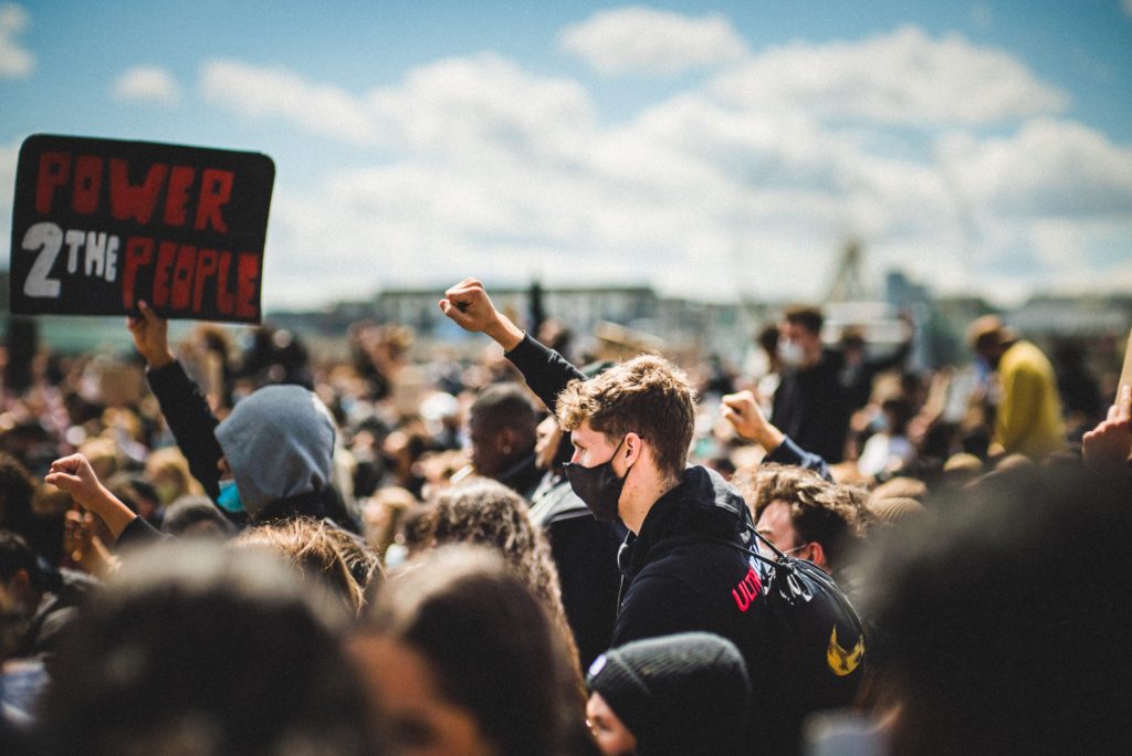 Civil Disobedience at Protests; protest with fist raised (photo credit: unsplash.com)