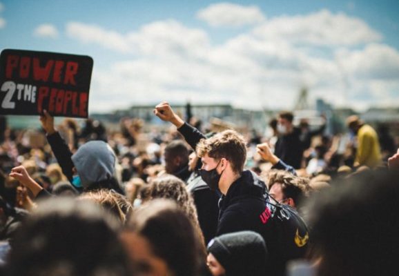 protest with fist raised (photo credit: unsplash.com)