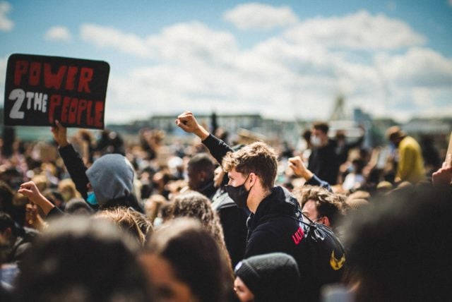 protest with fist raised (photo credit: unsplash.com)