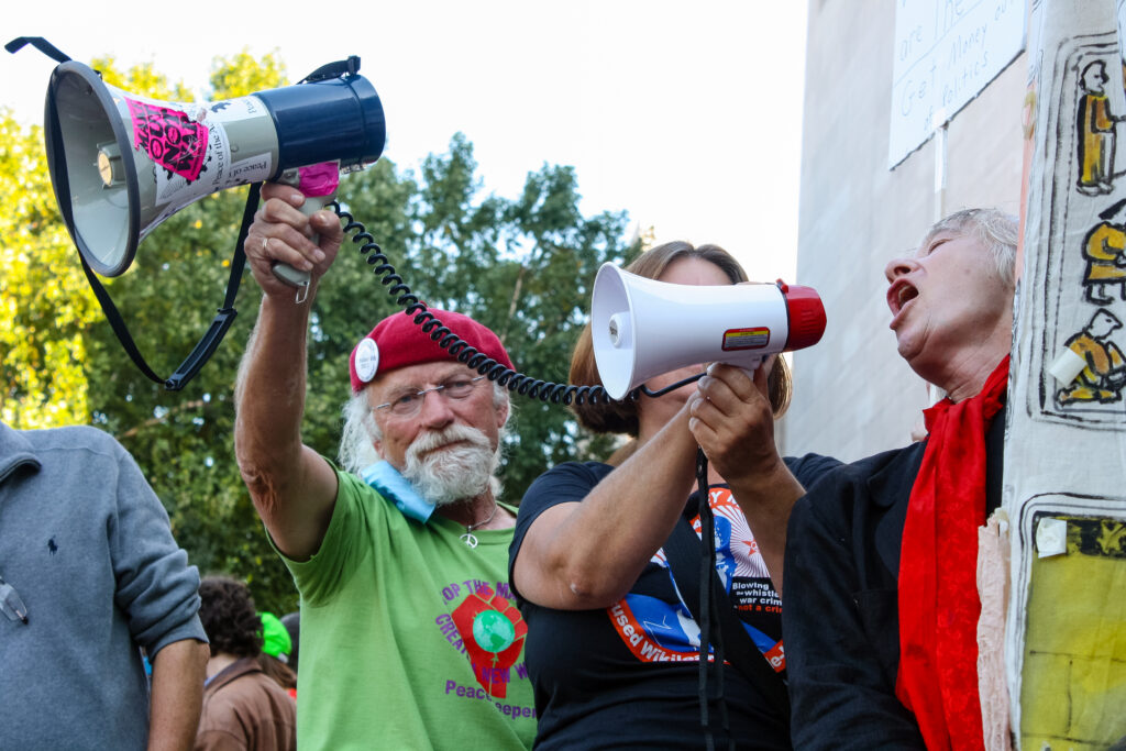 Freedom of Expression Handbook; Three protestors with microphones (photo credit: Evan McCaffrey)