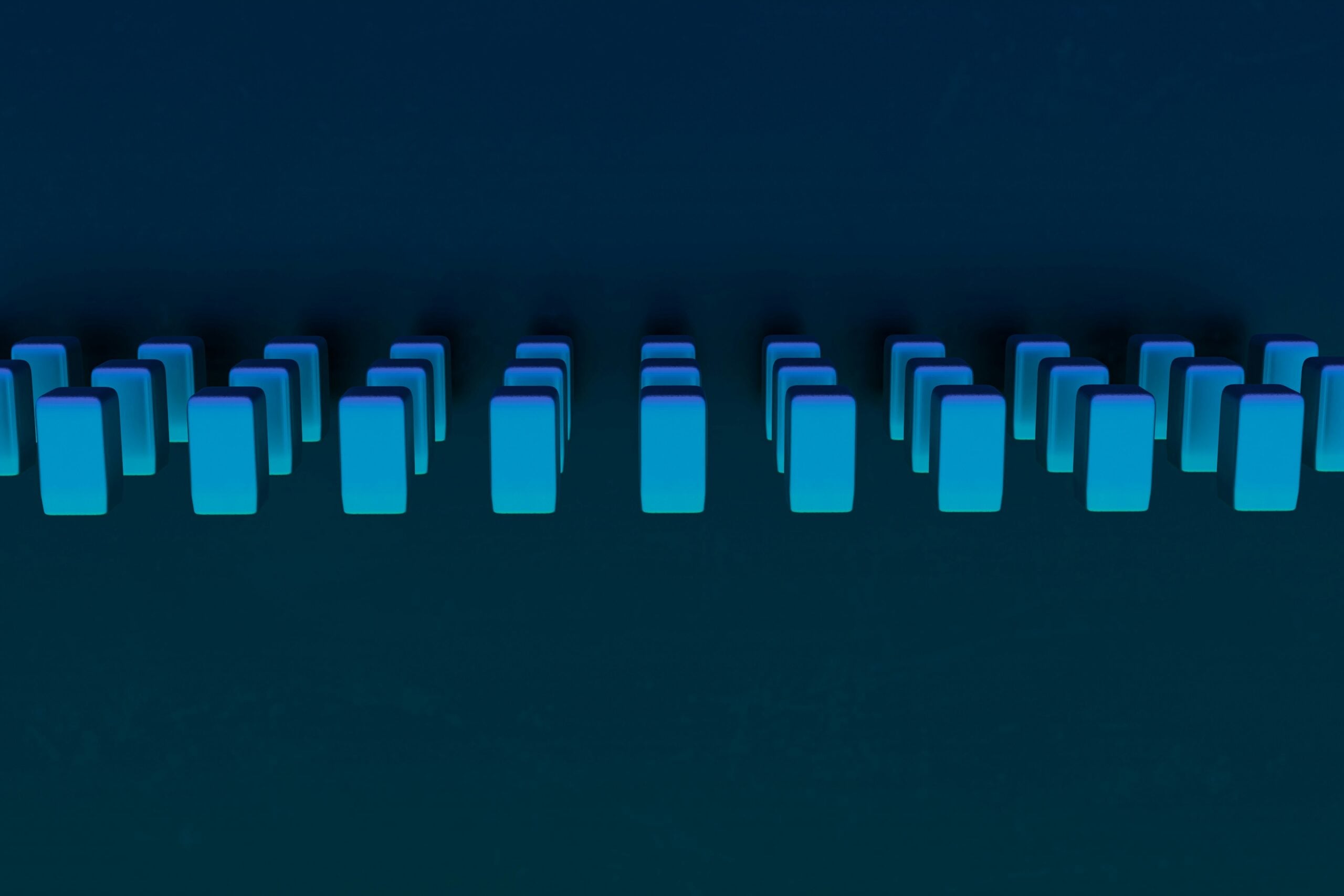 Series of blue rectangles in groups of three over dark blue background. 3d render by Steve Johnson via unsplash