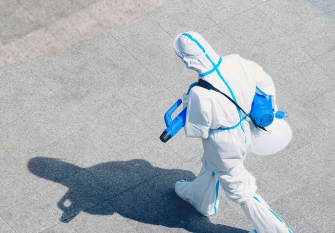 person in a white suit, photo credit Xiangkun ZHU, taken from https://www.icnl.org/wp-content/uploads/xiangkun-zhu-QtEPKaES3Nk-unsplash-686x476.jpg